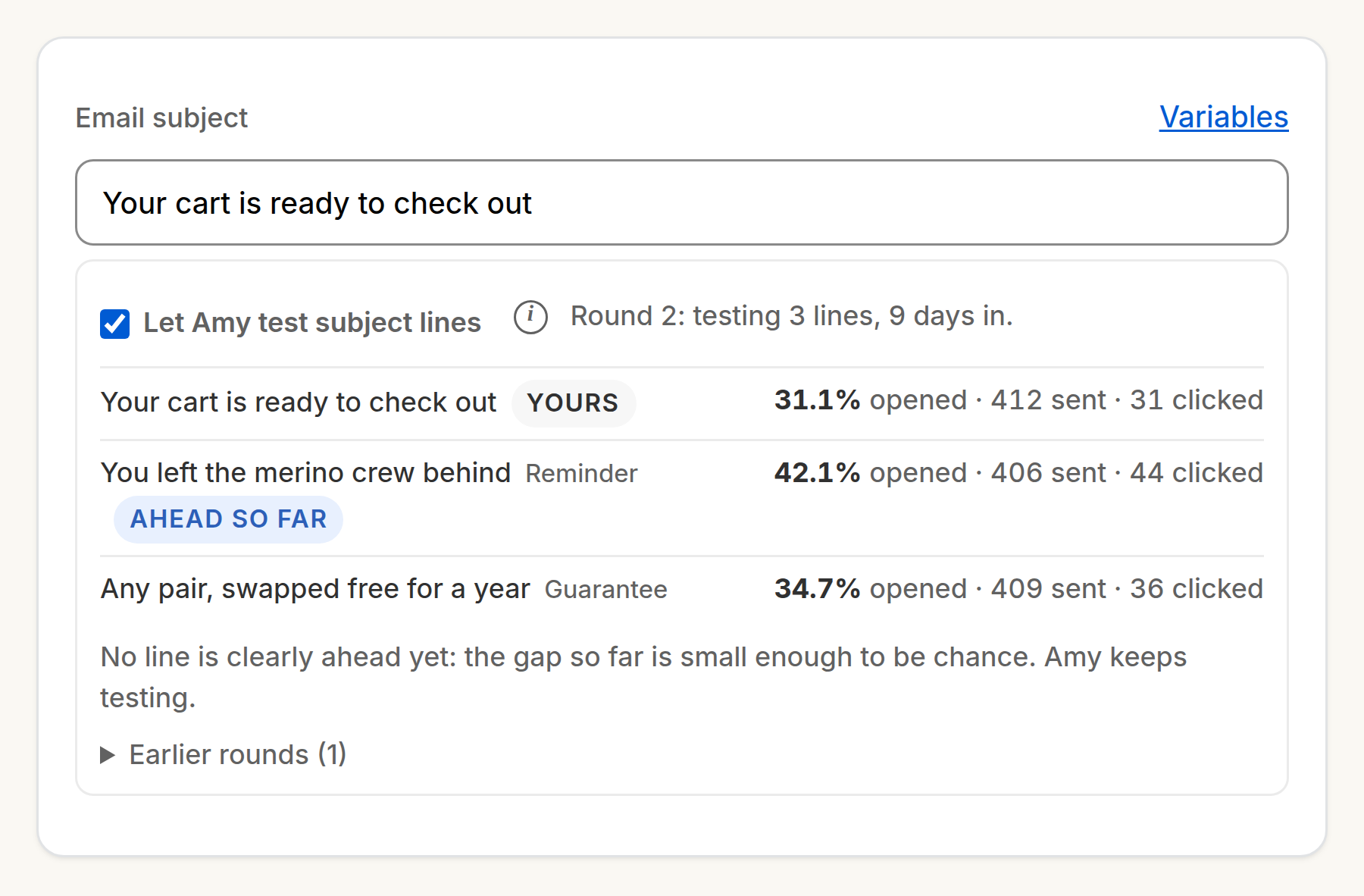 The abandoned-cart email’s subject line test, round two: the store’s own line against two of Amy’s, each with its open rate, sends and clicks, one marked Ahead so far.